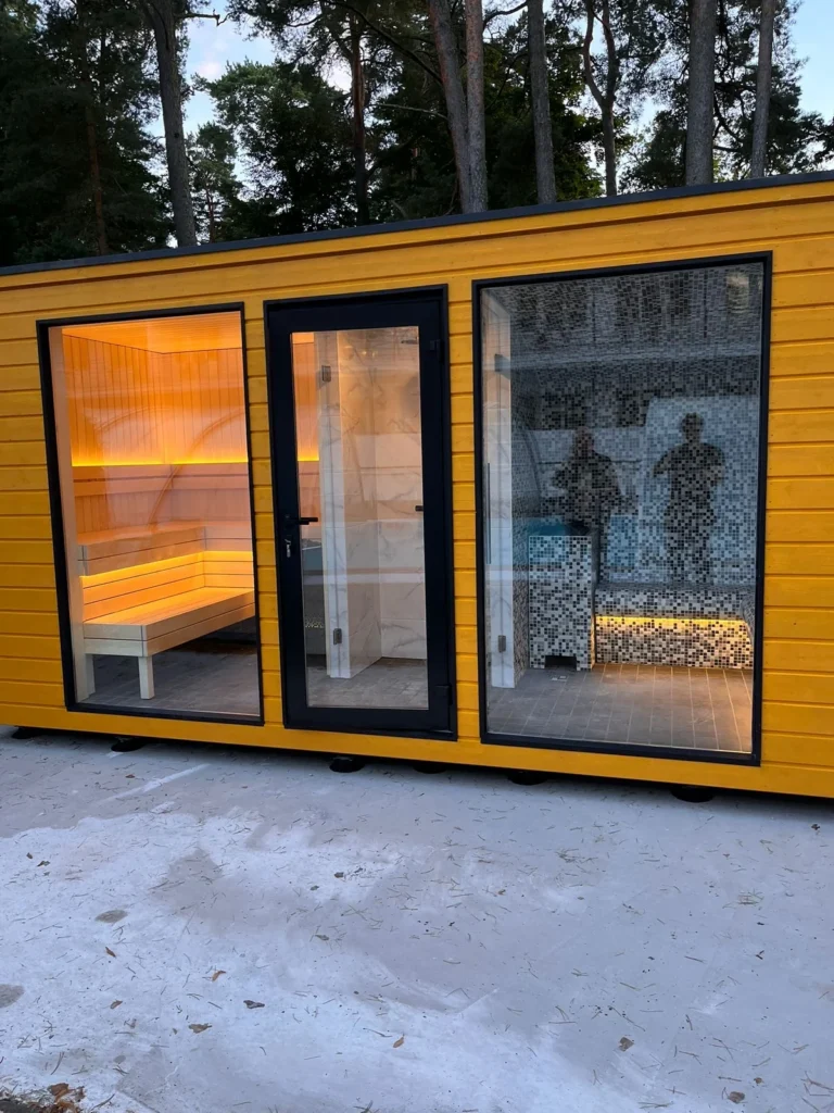 Garden home spa building with three glazed bays opening onto the sauna, shower and steam room