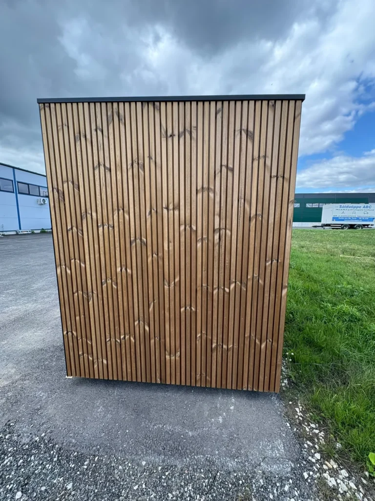 Signature M outdoor sauna seen from the side, showing the vertical timber cladding